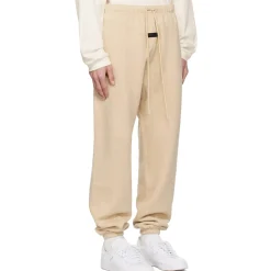 Fear Of God Essentials Gold Heather Sweatpants (FW23)< Bottoms|Matching Sets