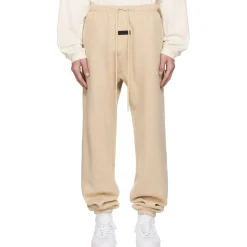 Fear Of God Essentials Gold Heather Sweatpants (FW23)< Bottoms|Matching Sets